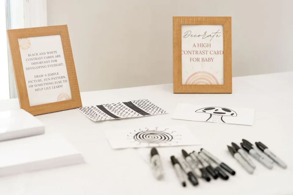 An event writing station with framed instructions, cards and markers